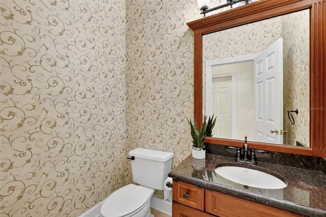 a view of a kitchen with a sink and a fireplace