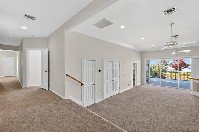 a view of an empty room with stairs