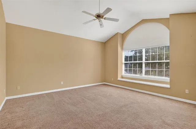 a view of a house with swimming pool and sitting area