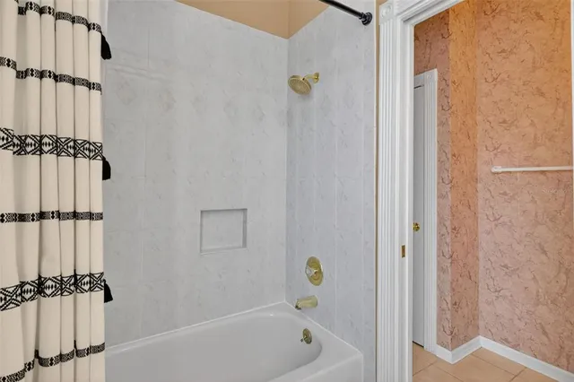 a open kitchen with granite countertop a sink and white cabinets