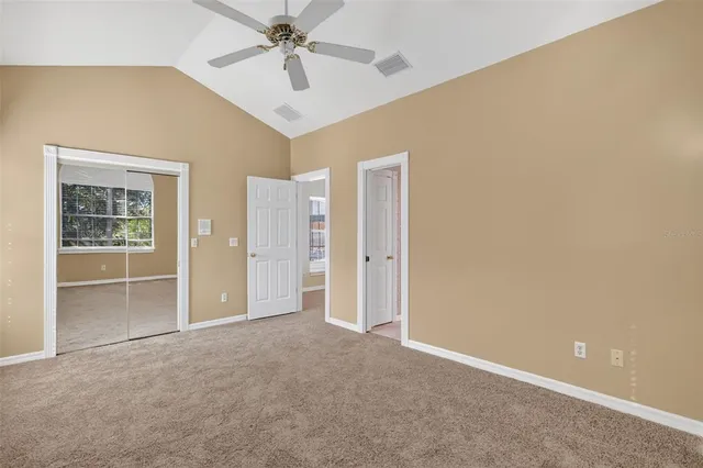 a view of a swimming pool with an outdoor space and seating area