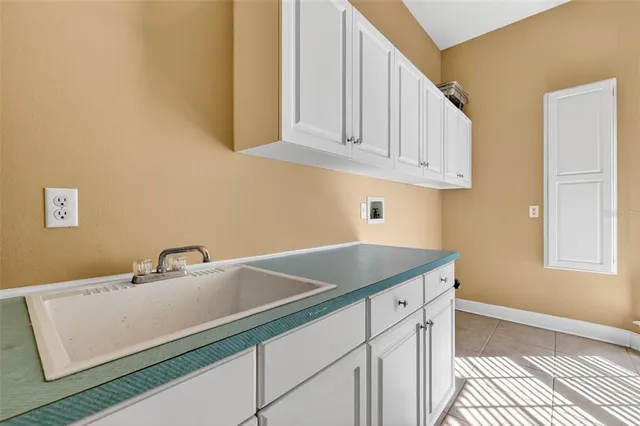 a view of a lake with a trees in the background