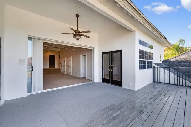 a view of a balcony with wooden floor