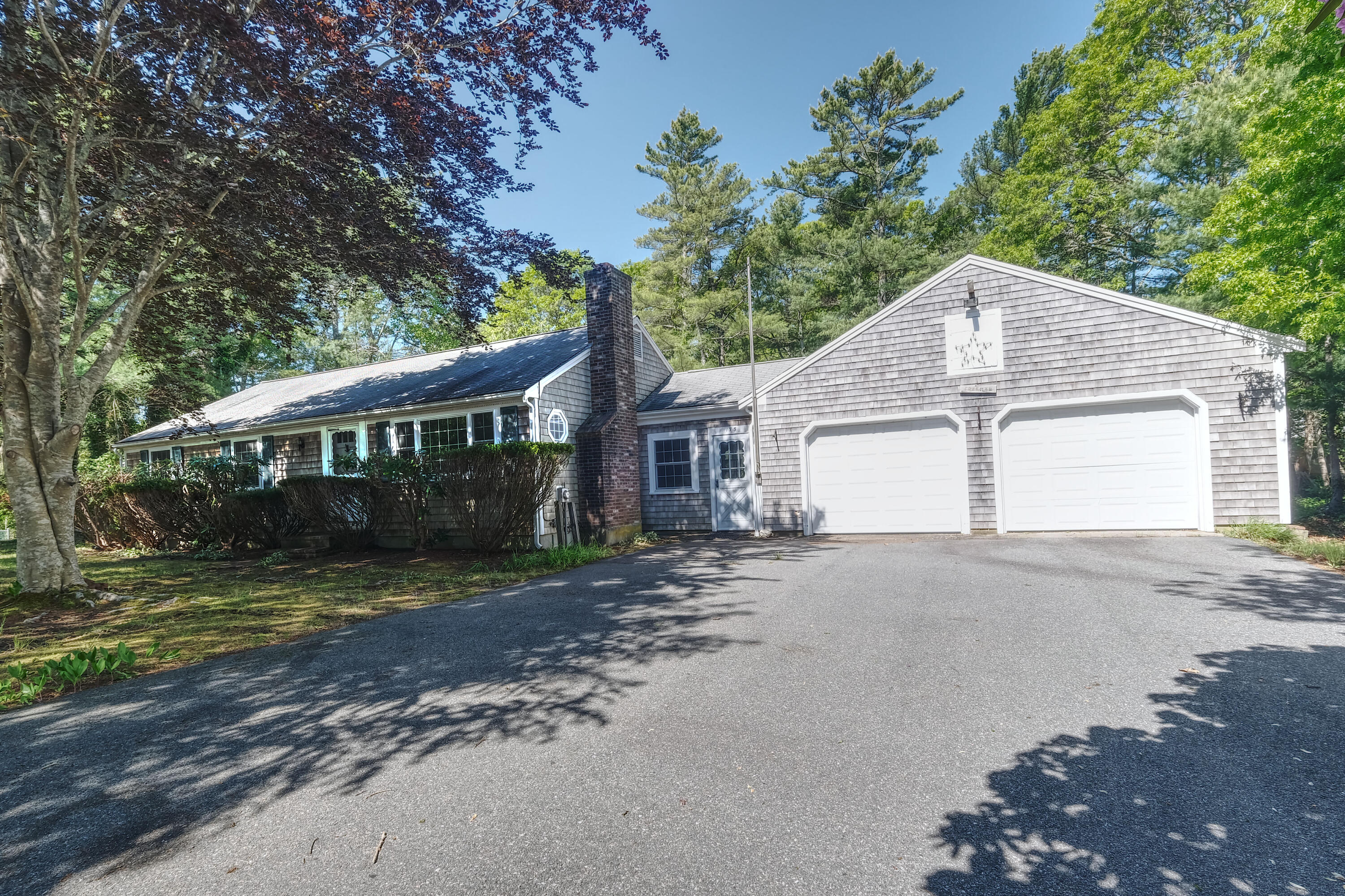 175 Knotty Pine Lane Centerville, MA 02632 - Photo 48 of 60 a view of a house with a yard