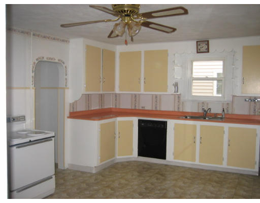 109 Grove Street Clinton, MA 01510 - Photo 3 of 6 a kitchen with stainless steel appliances granite countertop a sink and a refrigerator