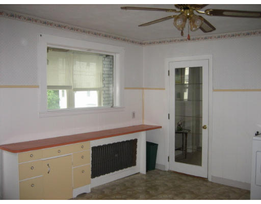 109 Grove Street Clinton, MA 01510 - Photo 4 of 6 a kitchen with a sink and a mirror