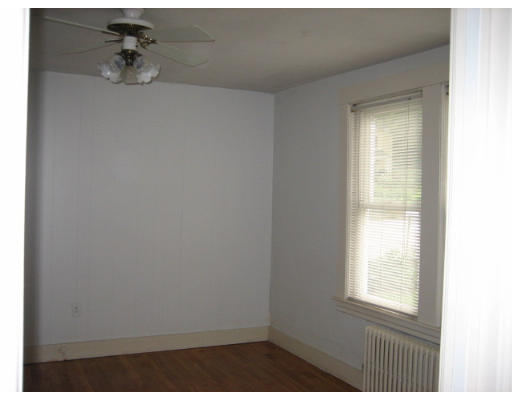 109 Grove Street Clinton, MA 01510 - Photo 6 of 6 a view of an empty room with a window