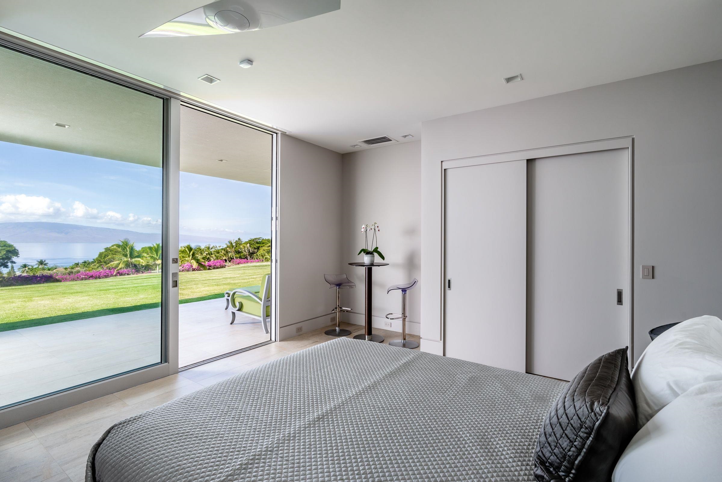 936 Punakea Loop Lahaina, HI 96761 - Photo 20 of 37 a bedroom with a bed and a large window