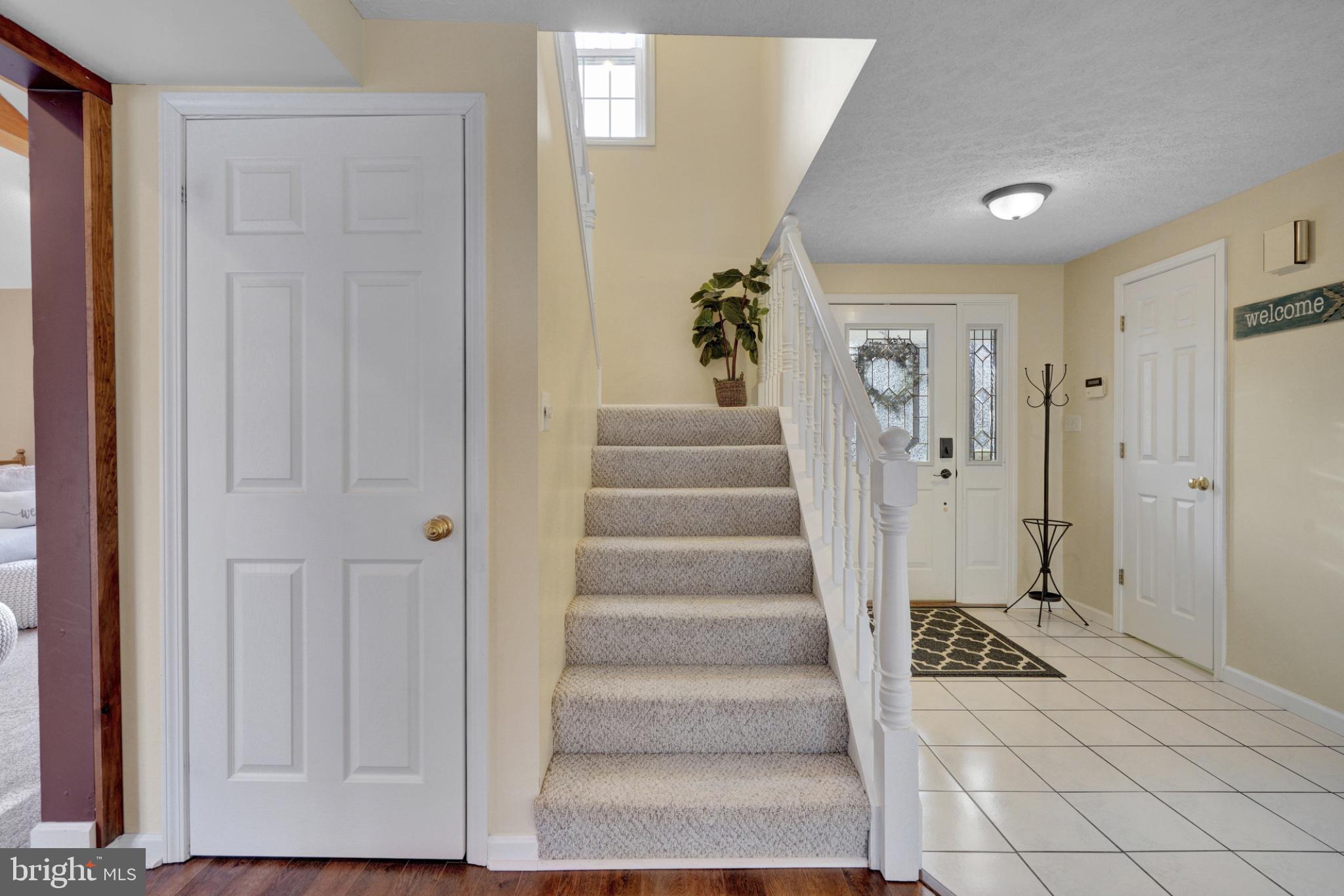 259 A A-Frame Road Coudersport, PA 16915 - Photo 13 of 130 Welcoming entryway with staircase charm.