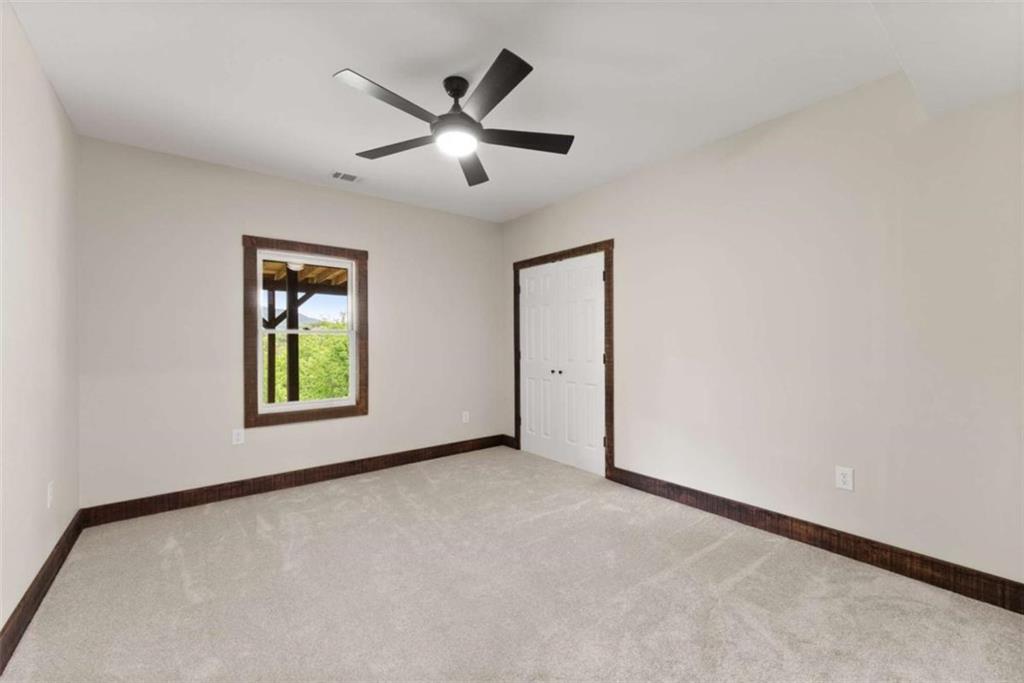 707 South Fern Cove Road Sautee Nacoochee, GA 30571 - Photo 27 of 60 an empty room with windows and closet