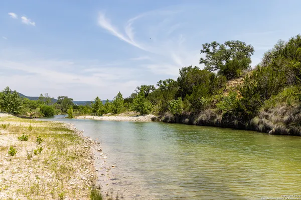a view of a lake view with houses in the background