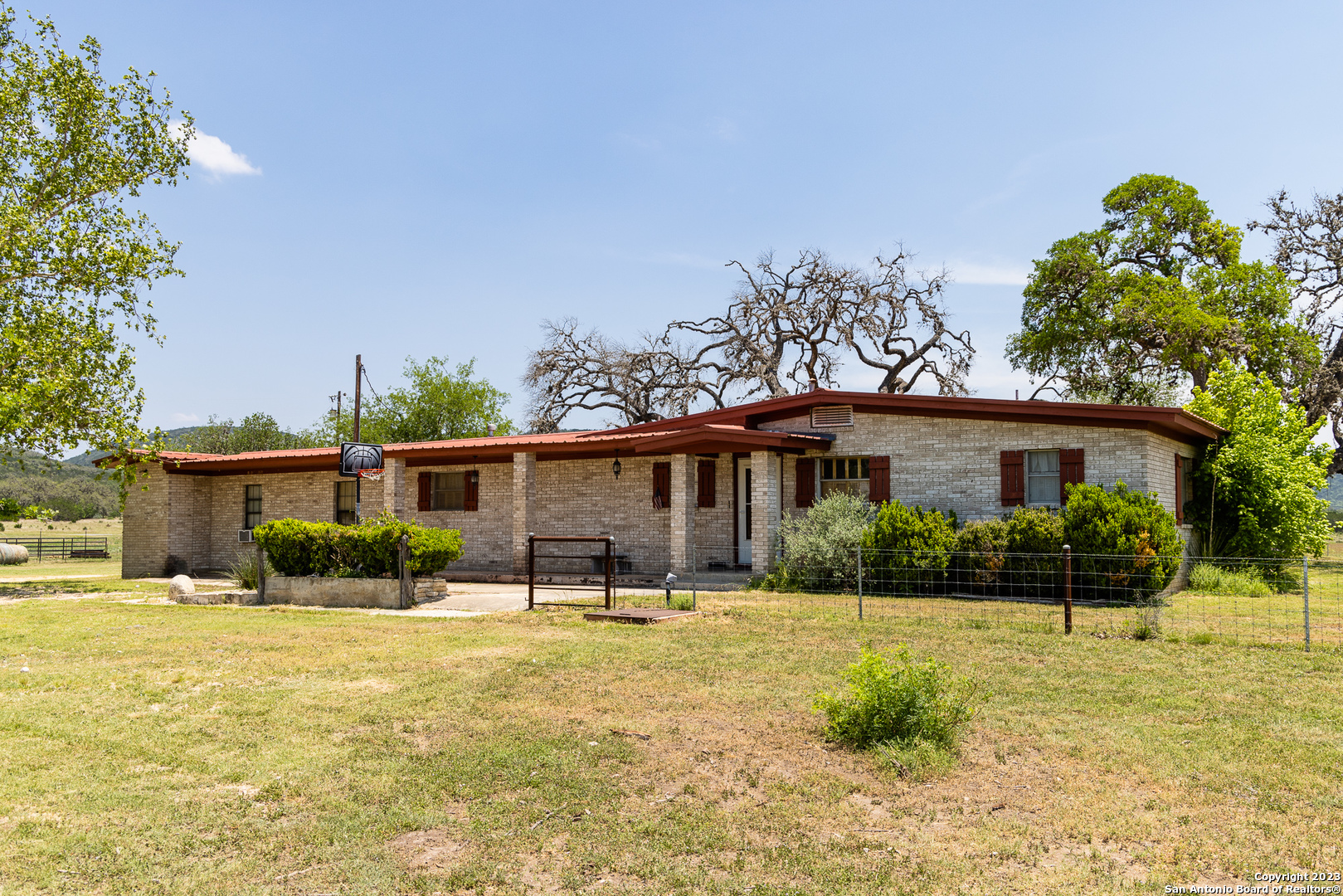 5374 County Road 111 Utopia, TX 78884 - Photo 2 of 24 a front view of a house with garden