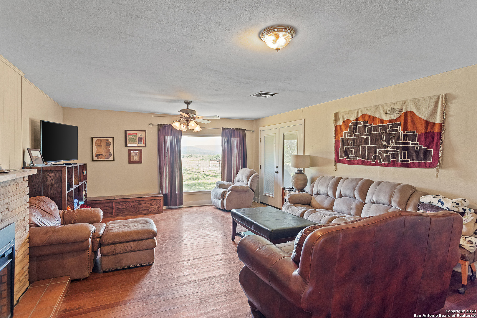5374 County Road 111 Utopia, TX 78884 - Photo 9 of 24 a living room with furniture and a flat screen tv