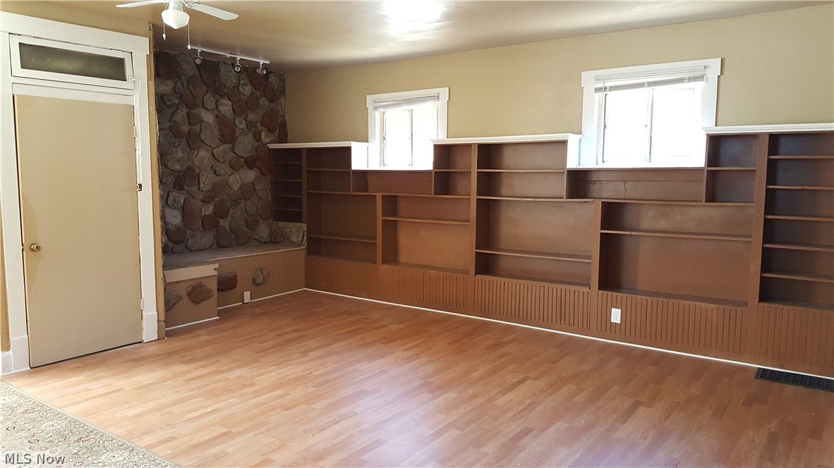 862 Walnut Road Southeast Massillon, OH 44646 - Photo 5 of 22 Living room has tons of built in shelves to allow for easy storage and great character.