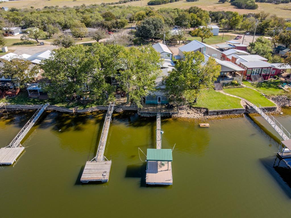 1601 Forum Circle, Unit 156 Graford, TX 76449 - Photo 2 of 28 an aerial view of a house with a lake view