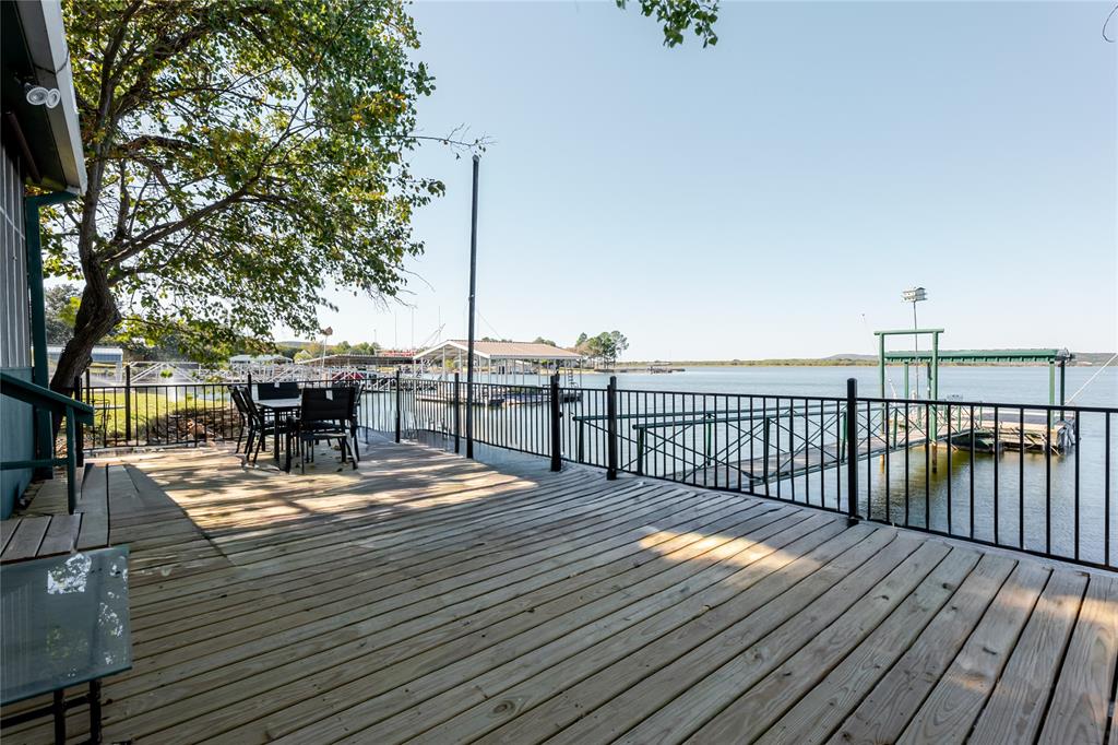 1601 Forum Circle, Unit 156 Graford, TX 76449 - Photo 22 of 28 a view of a balcony with chairs