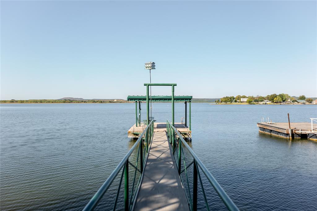 1601 Forum Circle, Unit 156 Graford, TX 76449 - Photo 23 of 28 a view of a lake with sitting area