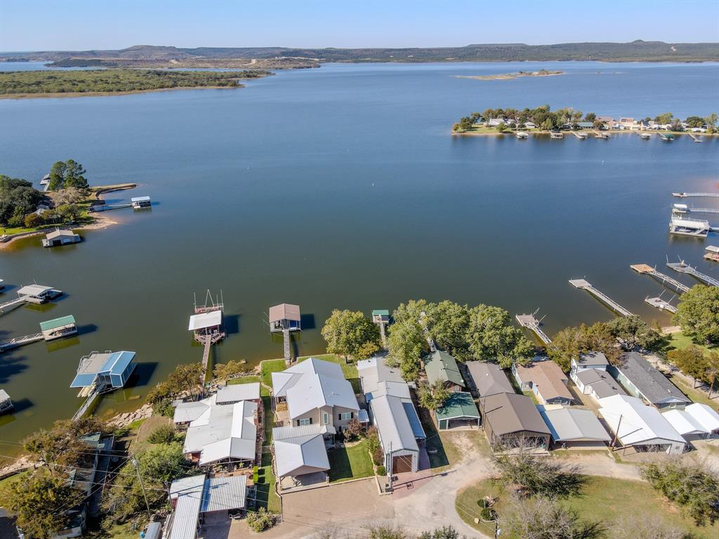 1601 Forum Circle, Unit 156 Graford, TX 76449 - Photo 24 of 28 an aerial view of a house with a lake view