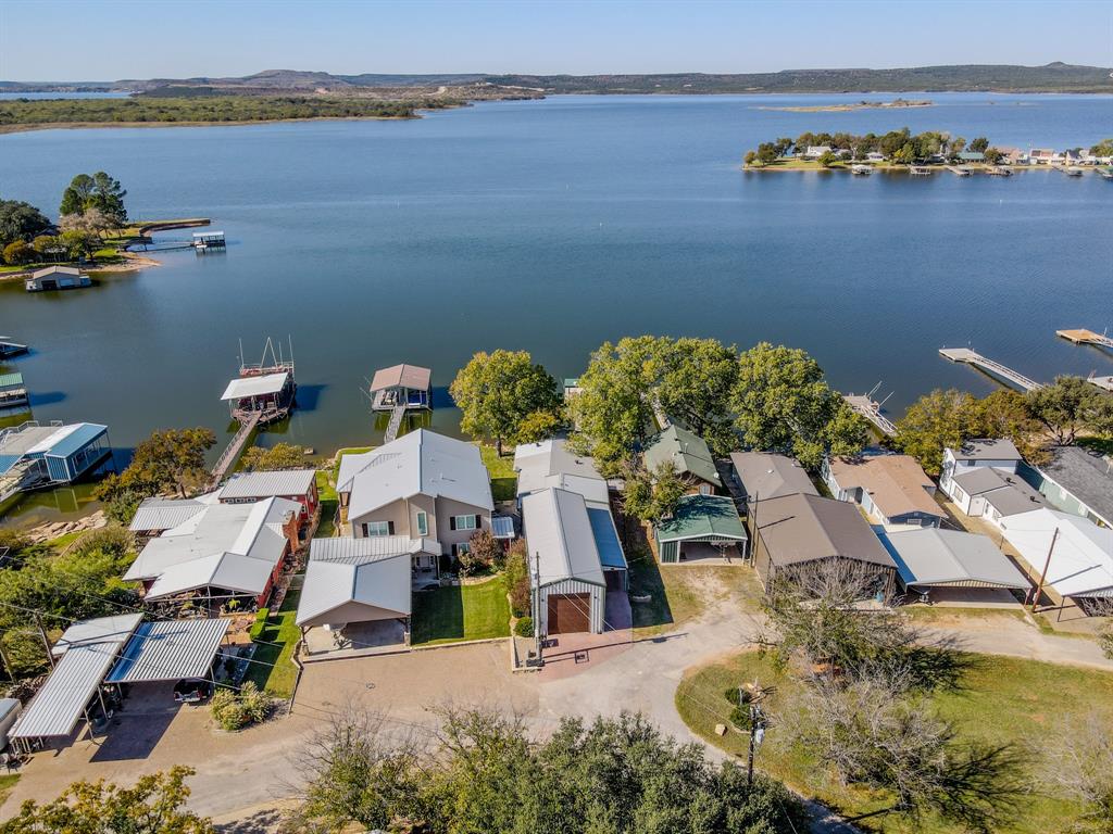 1601 Forum Circle, Unit 156 Graford, TX 76449 - Photo 25 of 28 an aerial view of a house with outdoor space swimming pool and lake view