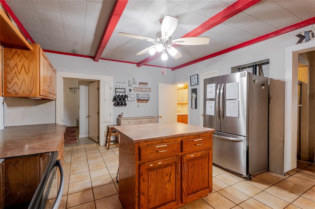 1601 Forum Circle, Unit 156 Graford, TX 76449 - Photo 6 of 28 a kitchen with stainless steel appliances granite countertop a refrigerator a stove and a sink