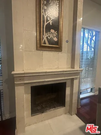a room with two washing machine and view of living room