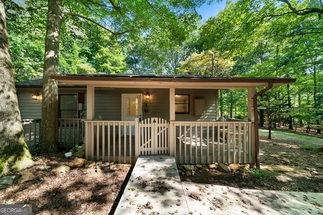 a view of a house with a small yard