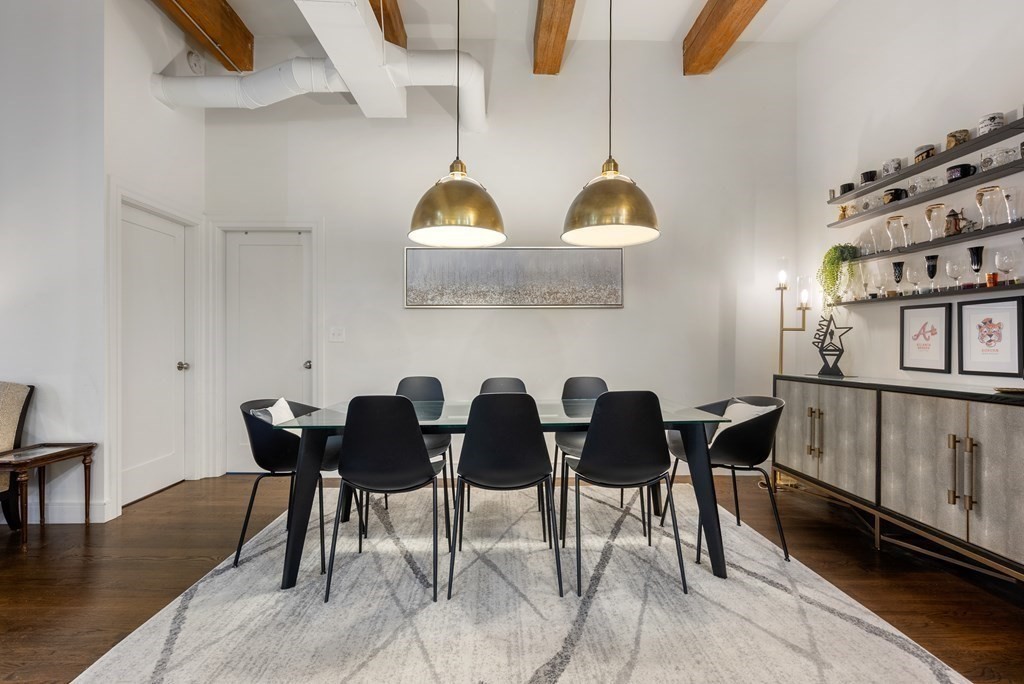 15 Sleeper Street, Unit 302 Boston, MA 02210 - Photo 13 of 35 a view of a dining room with furniture