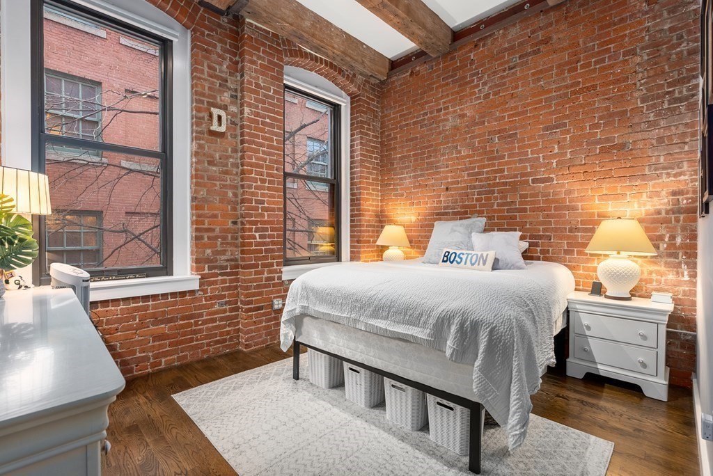 15 Sleeper Street, Unit 302 Boston, MA 02210 - Photo 23 of 35 a bedroom with a bed and window
