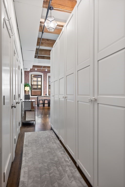 15 Sleeper Street, Unit 302 Boston, MA 02210 - Photo 27 of 35 a view of a hallway view with living room and furniture