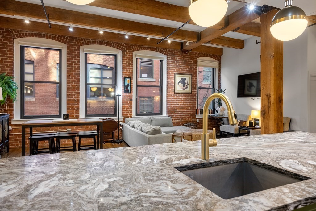 15 Sleeper Street, Unit 302 Boston, MA 02210 - Photo 5 of 35 a view of a livingroom with furniture and window