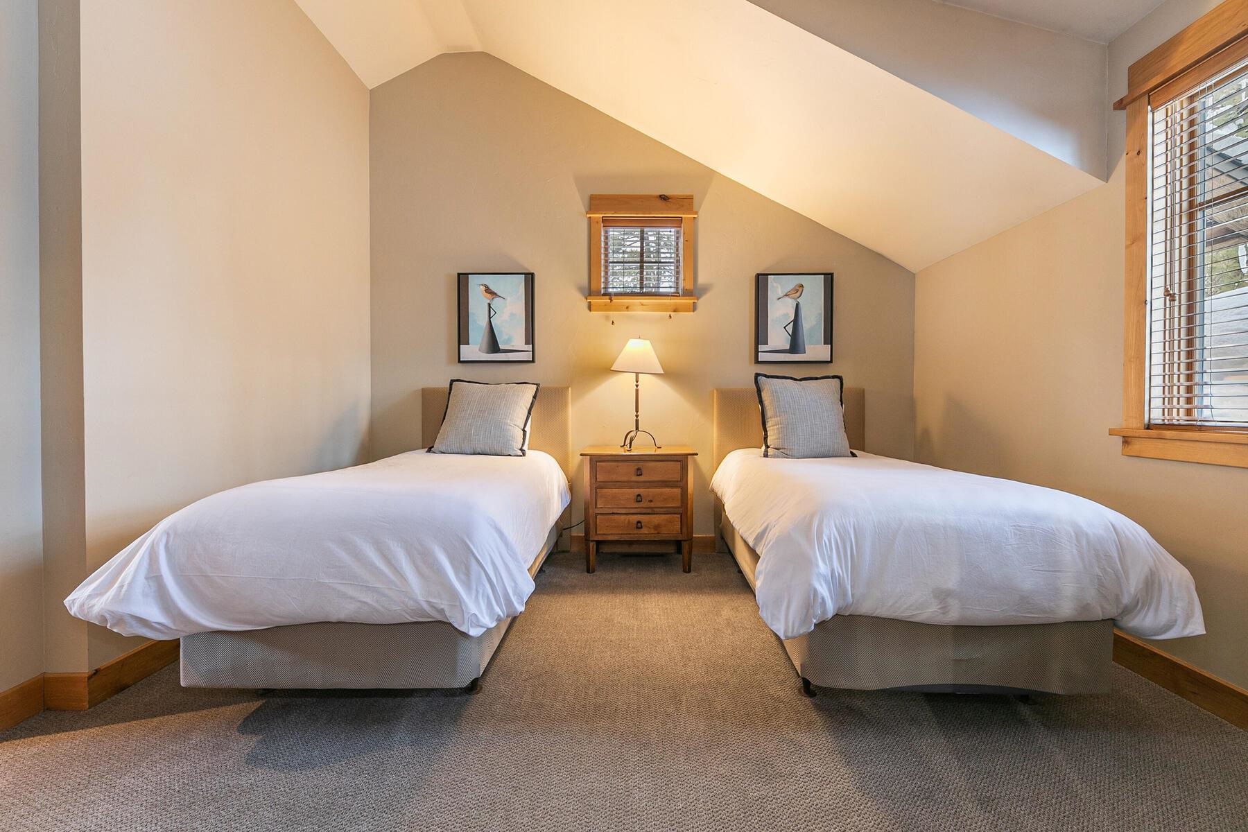 12498 Lookout Loop, Unit F3826 Truckee, CA 96161 - Photo 22 of 28 a bedroom with two beds and painting on the wall