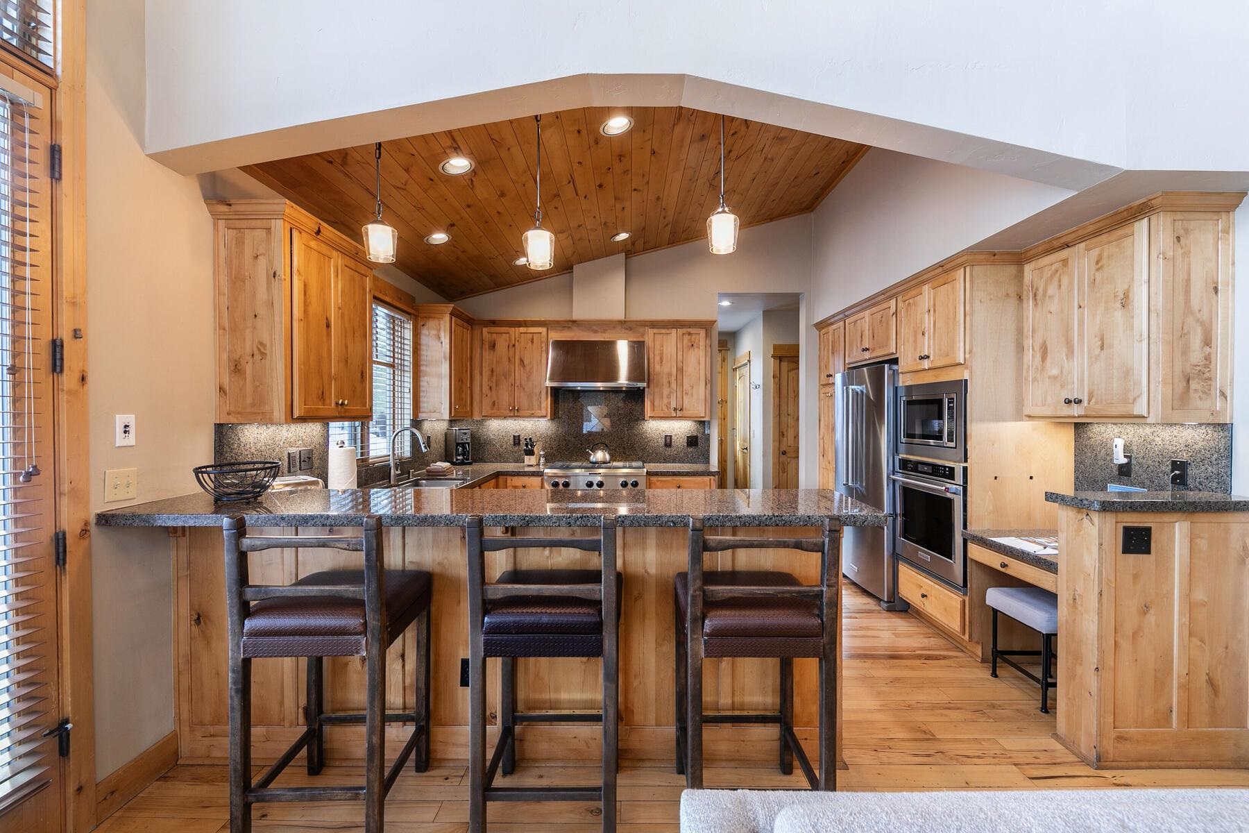 12498 Lookout Loop, Unit F3826 Truckee, CA 96161 - Photo 7 of 28 a view of kitchen with cabinets table and chairs