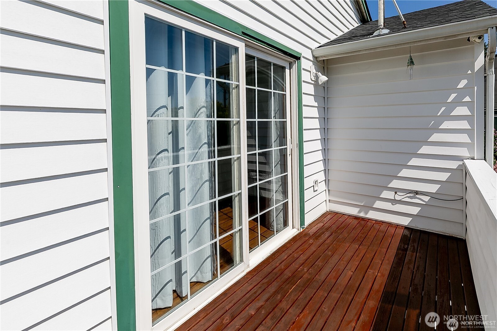 512 North 104th Street Seattle, WA 98133 - Photo 13 of 15 a view of a balcony with wooden floor and fence