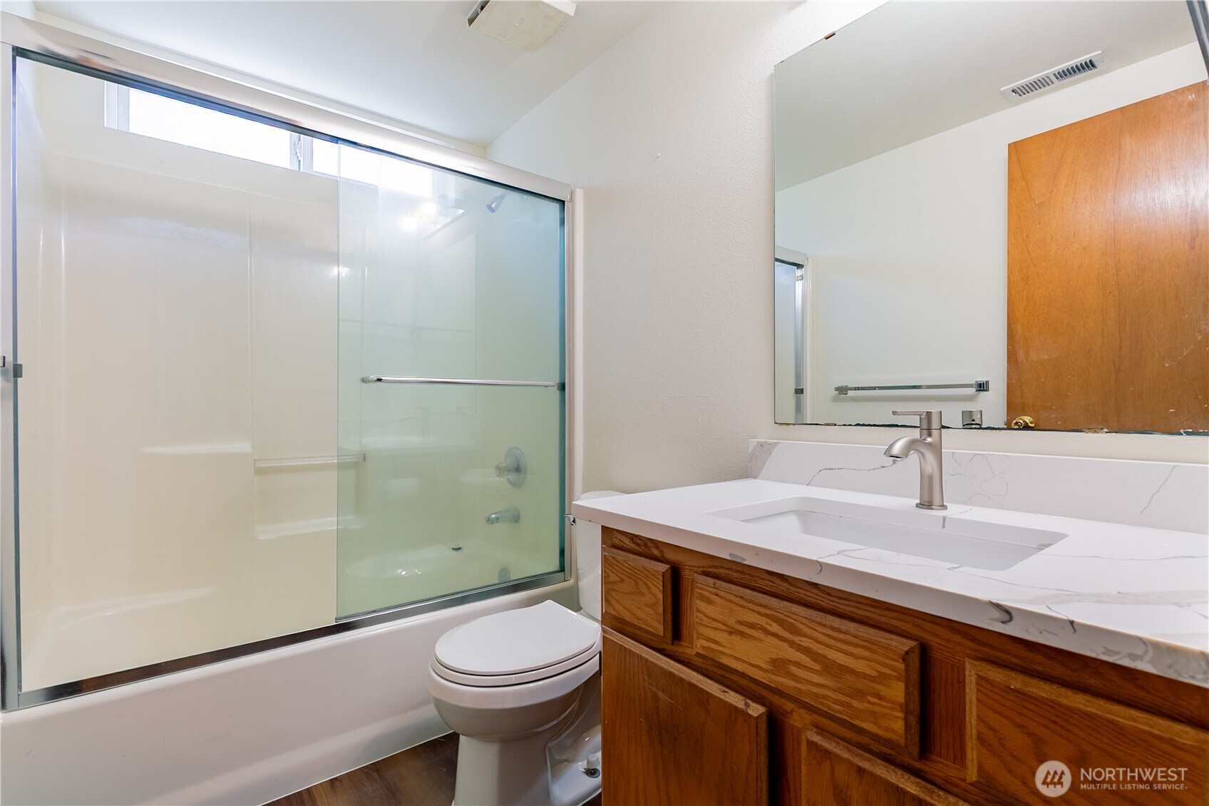 512 North 104th Street Seattle, WA 98133 - Photo 15 of 15 a bathroom with a sink a toilet and shower