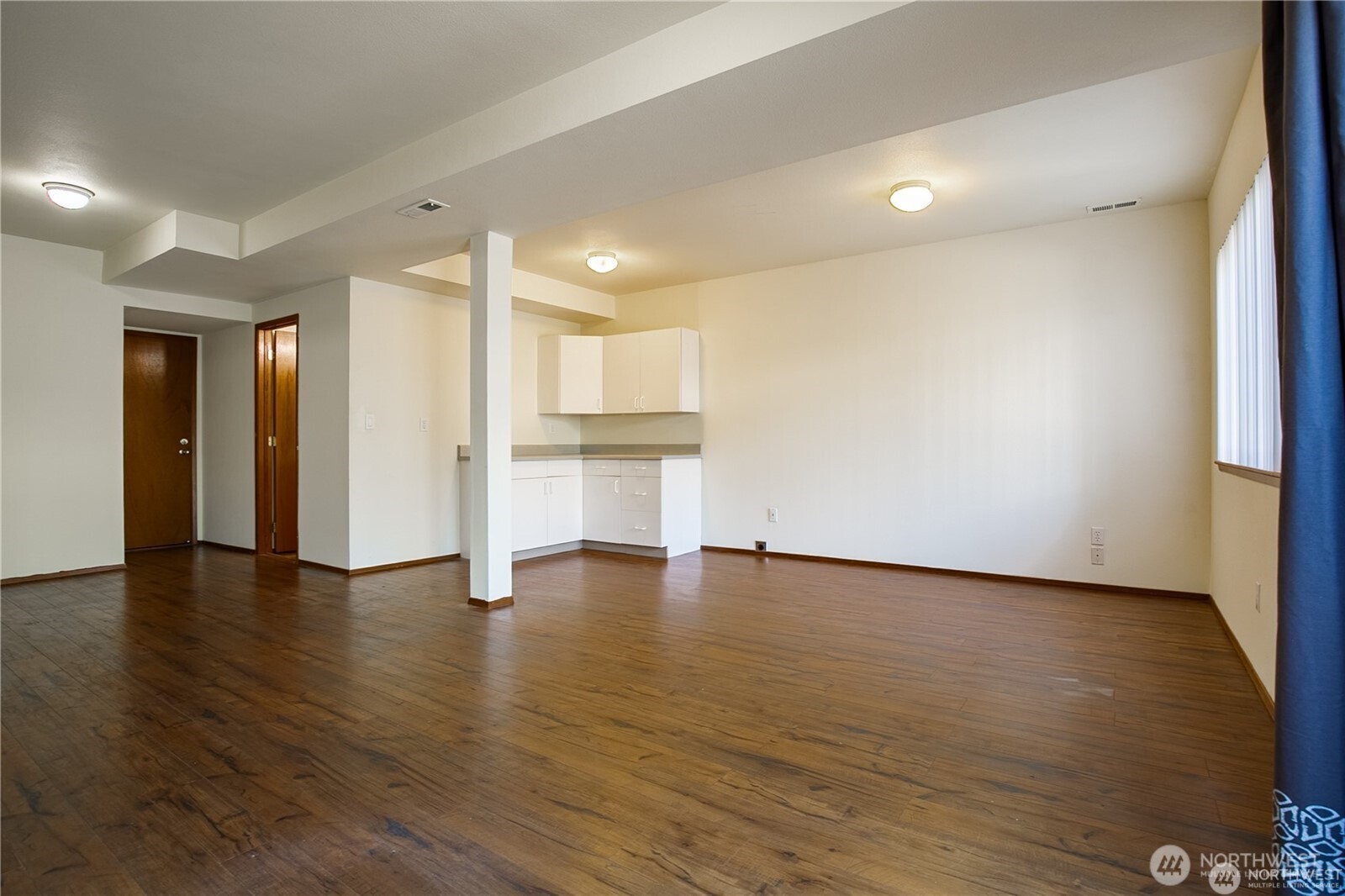 512 North 104th Street Seattle, WA 98133 - Photo 7 of 15 a view of empty room with wooden floor