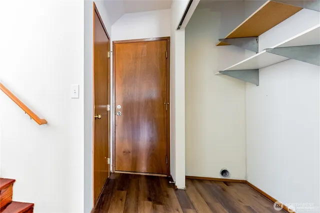 a view of front door with wooden floor