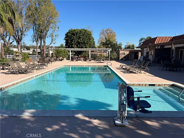 a view of swimming pool with outdoor seating