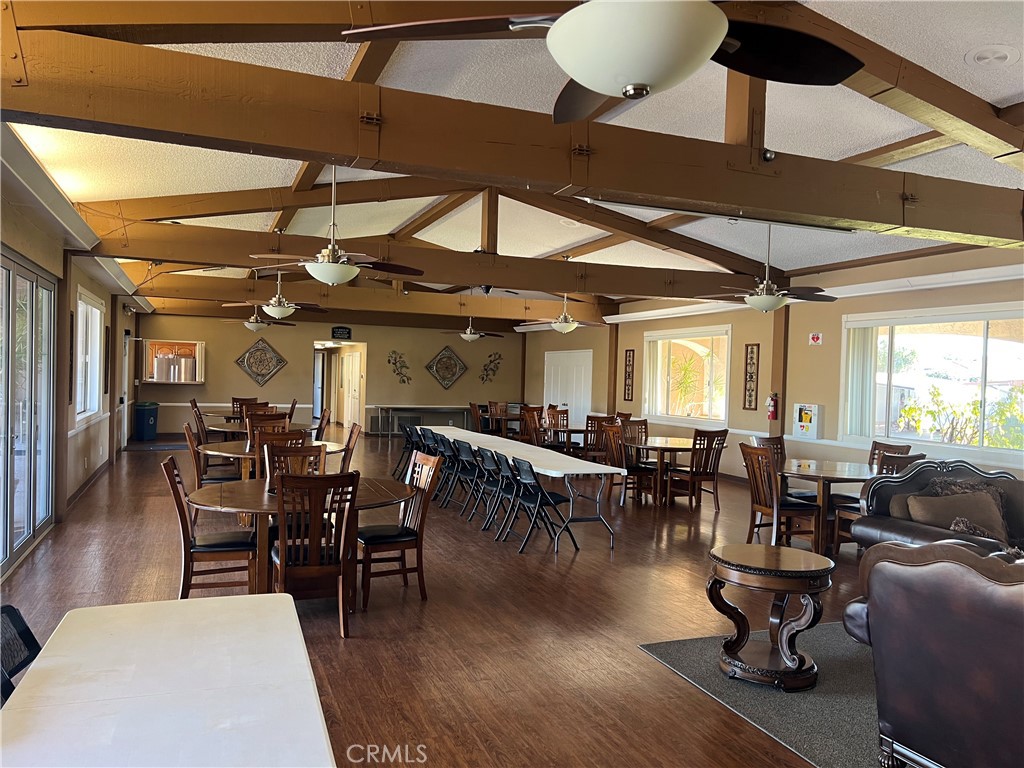 1001 West Lambert Road, Unit 284 La Habra, CA 90631 - Photo 27 of 28 a view of a dining room with furniture window and wooden floor
