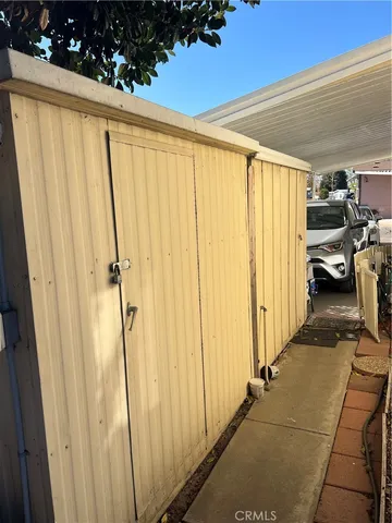 a view of a room with wooden floor and windows