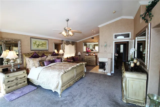 a large bedroom with bed and window