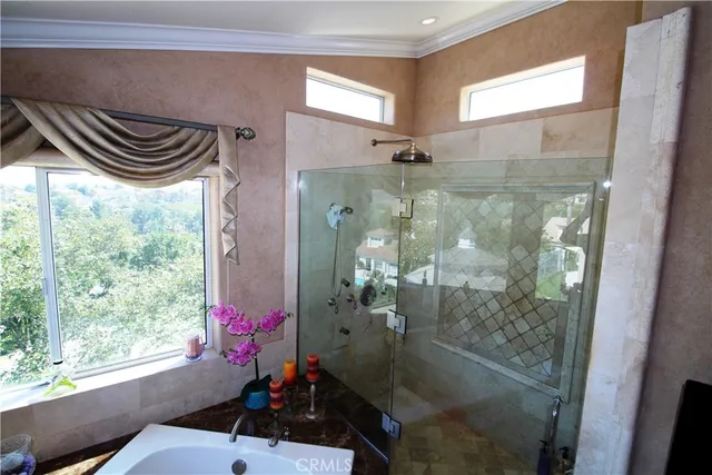 a bathroom with a shower and a sink