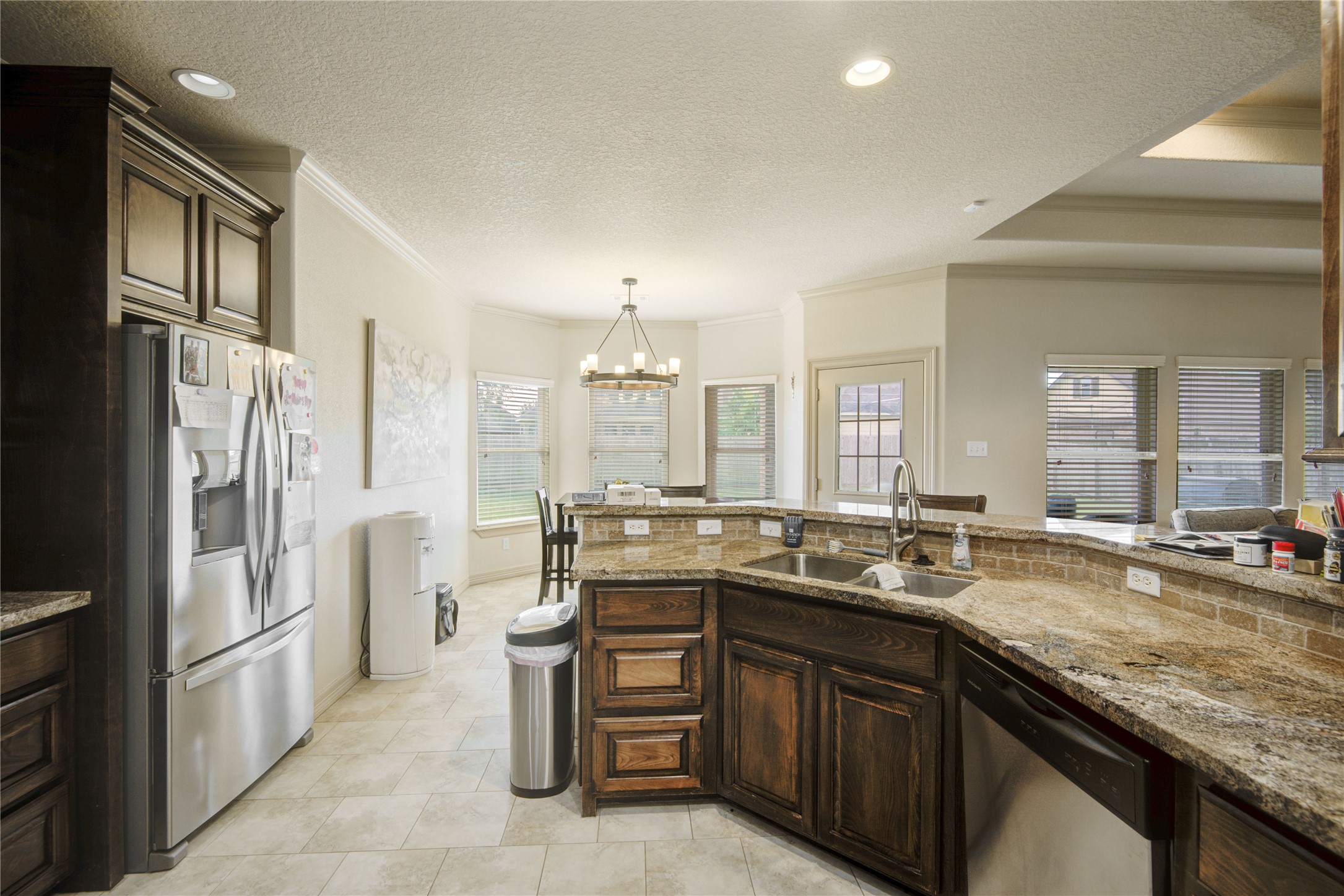 57 Red Maple Court Lake Jackson, TX 77566 - Photo 11 of 44 a kitchen with a sink stove and refrigerator