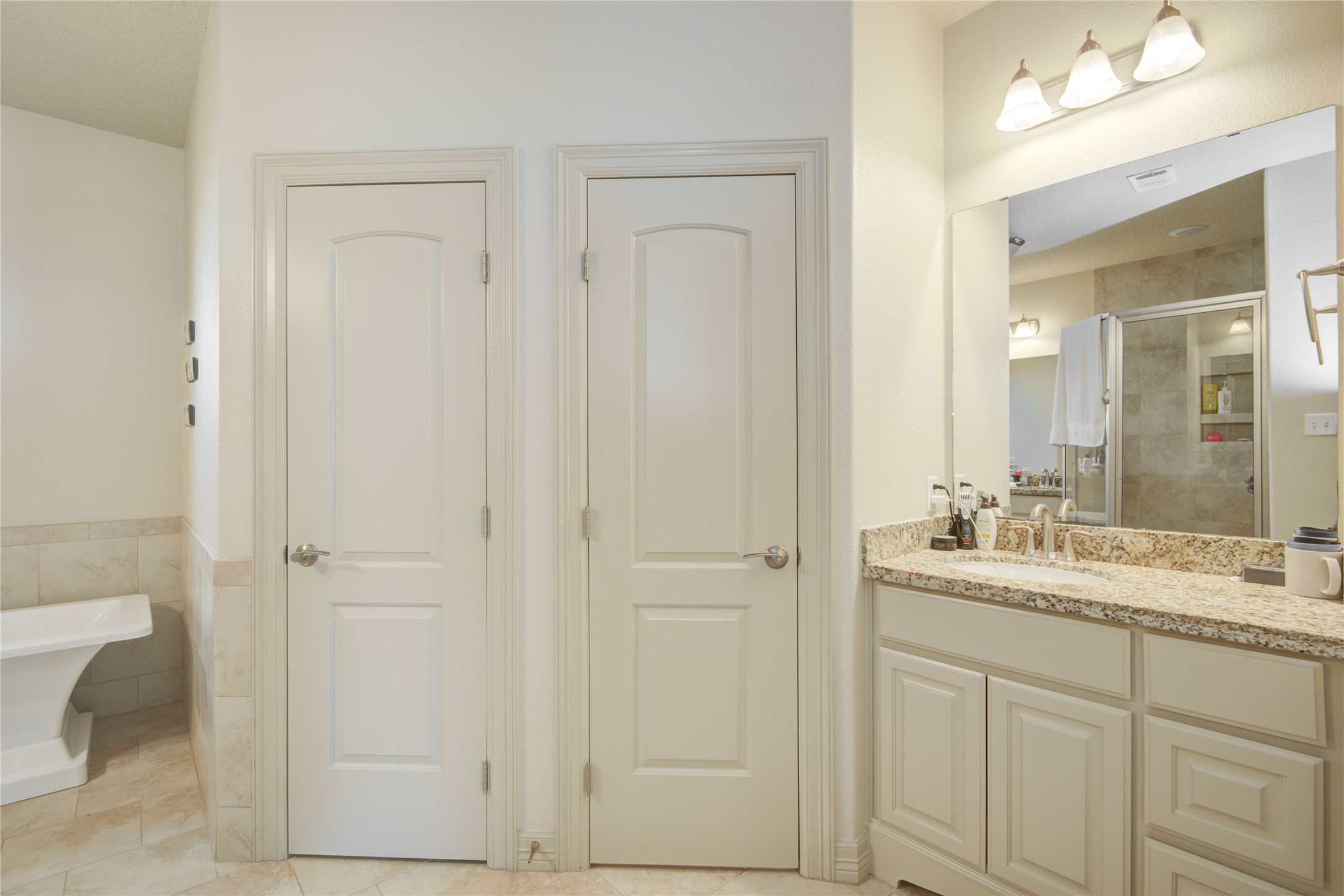 57 Red Maple Court Lake Jackson, TX 77566 - Photo 17 of 44 a bathroom with a sink and a mirror