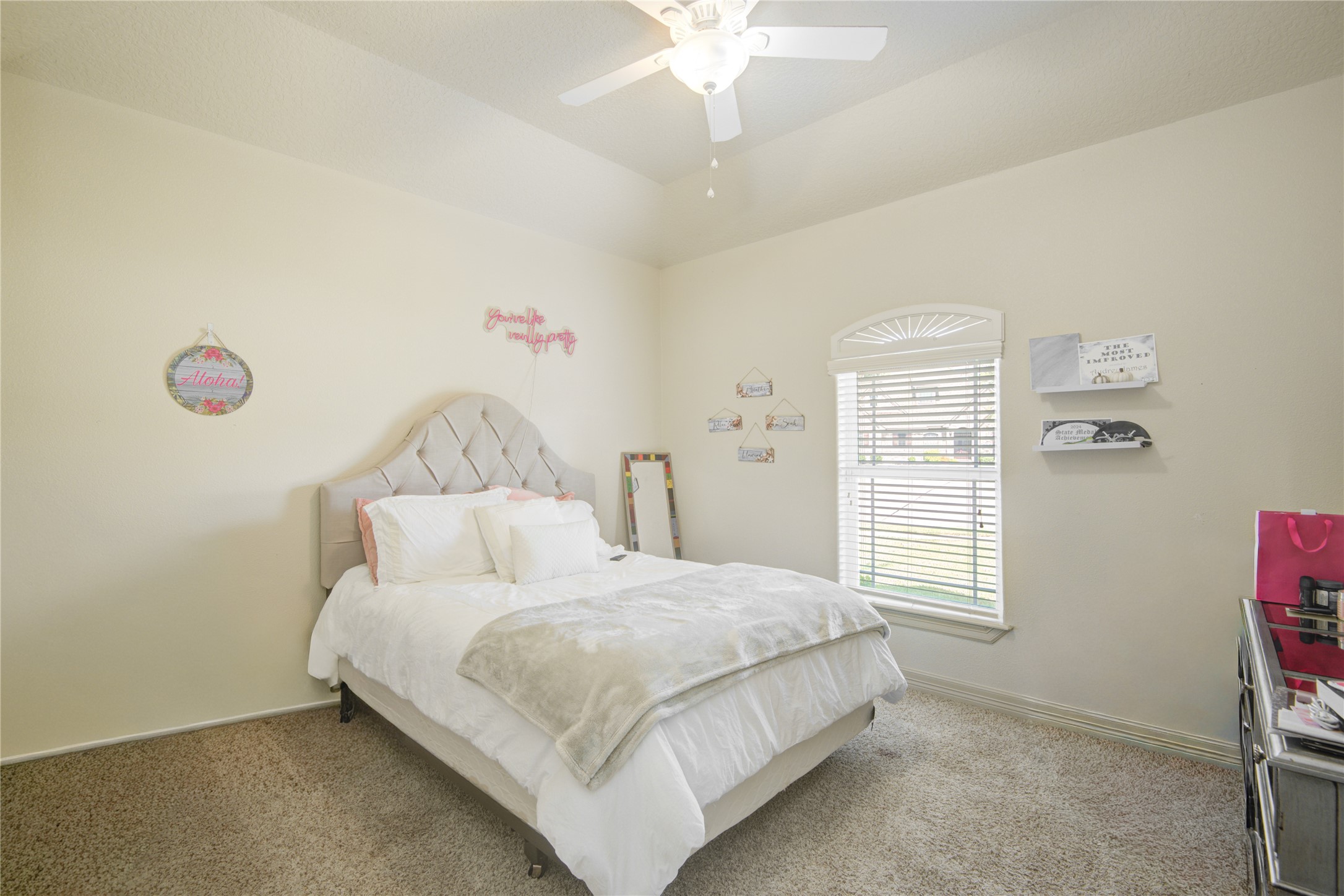 57 Red Maple Court Lake Jackson, TX 77566 - Photo 21 of 44 a bedroom with a bed and a window