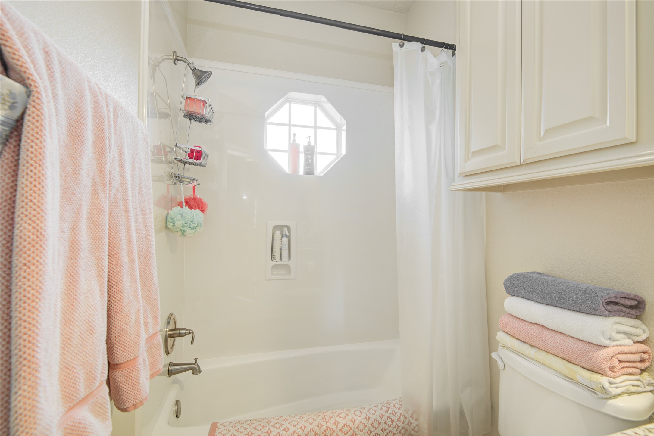 57 Red Maple Court Lake Jackson, TX 77566 - Photo 24 of 44 a bathroom with a bathtub and shower
