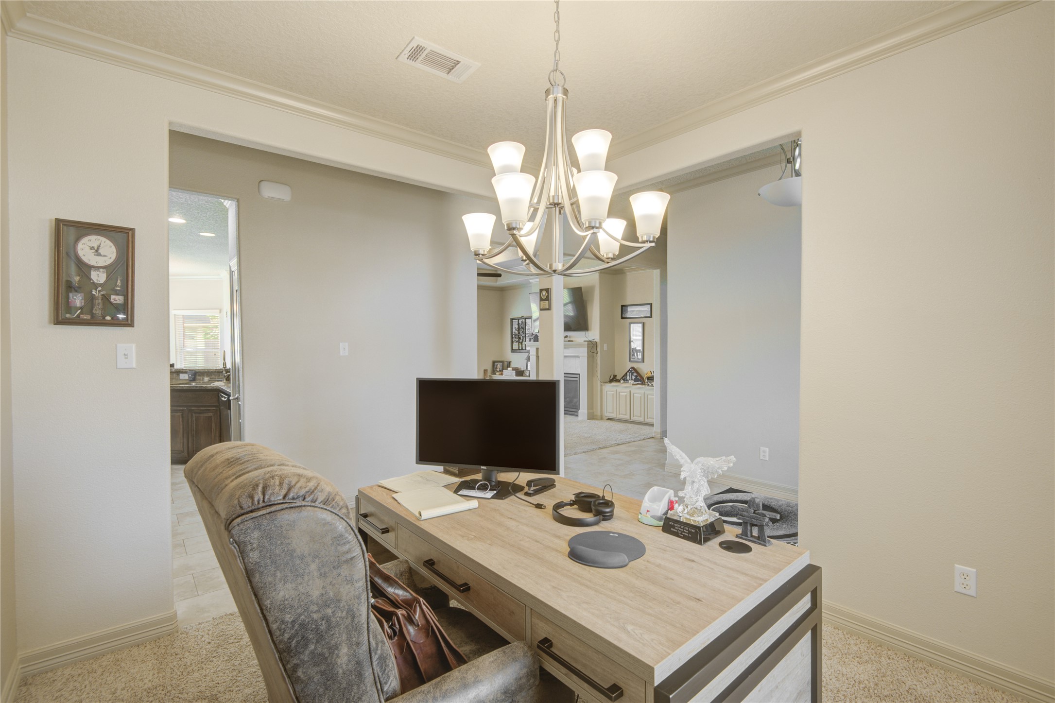 57 Red Maple Court Lake Jackson, TX 77566 - Photo 26 of 44 a view of a dining room with furniture and a chandelier