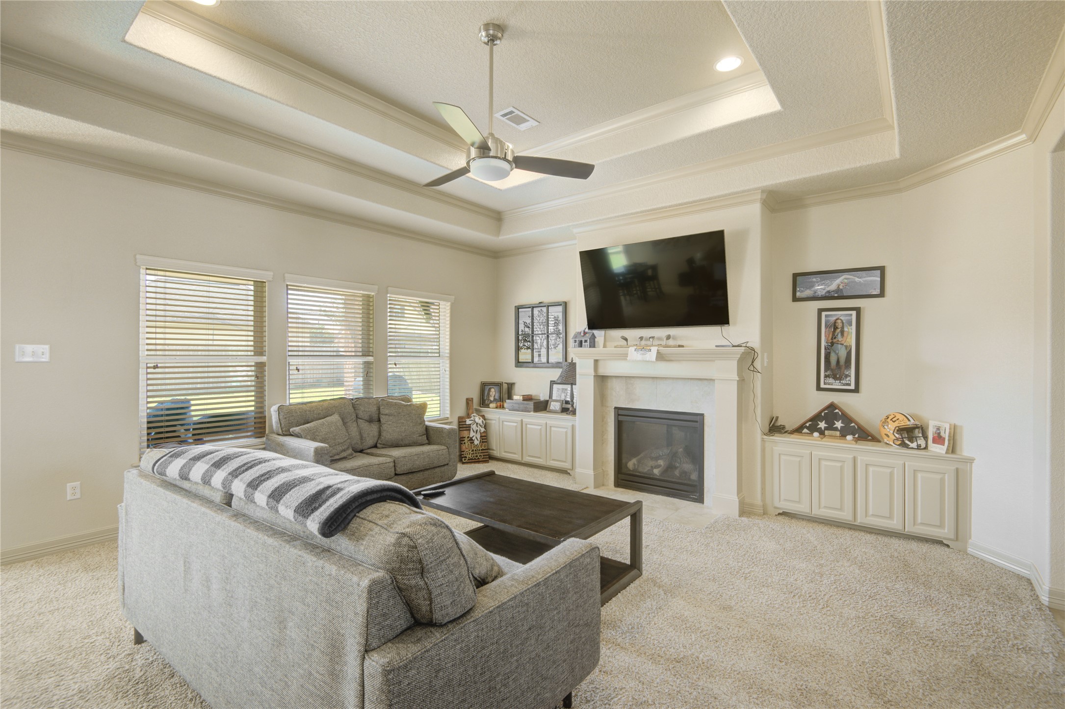 57 Red Maple Court Lake Jackson, TX 77566 - Photo 28 of 44 a living room with furniture a fireplace and a flat screen tv