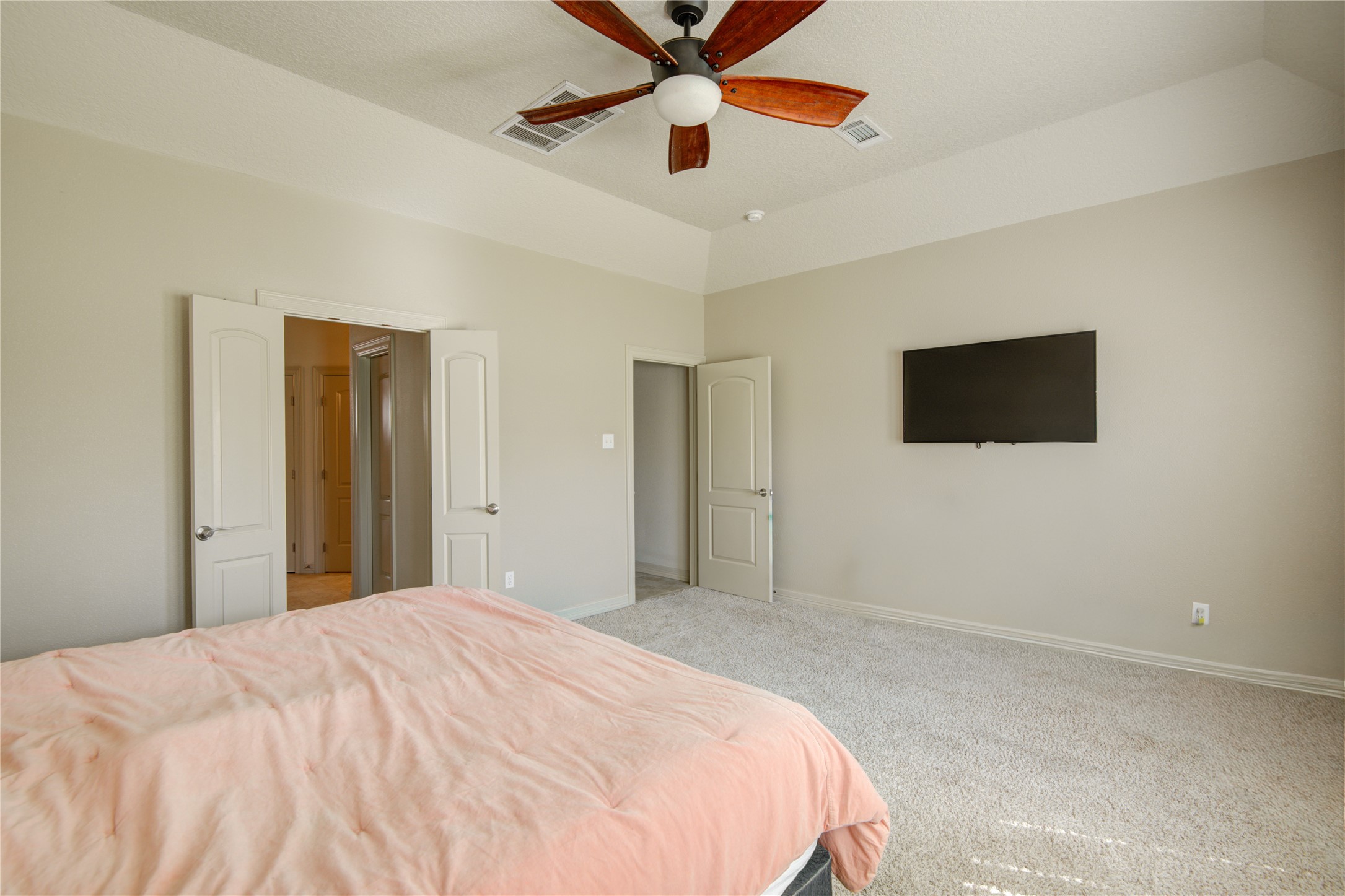 57 Red Maple Court Lake Jackson, TX 77566 - Photo 37 of 44 a bedroom with a bed and a flat screen tv