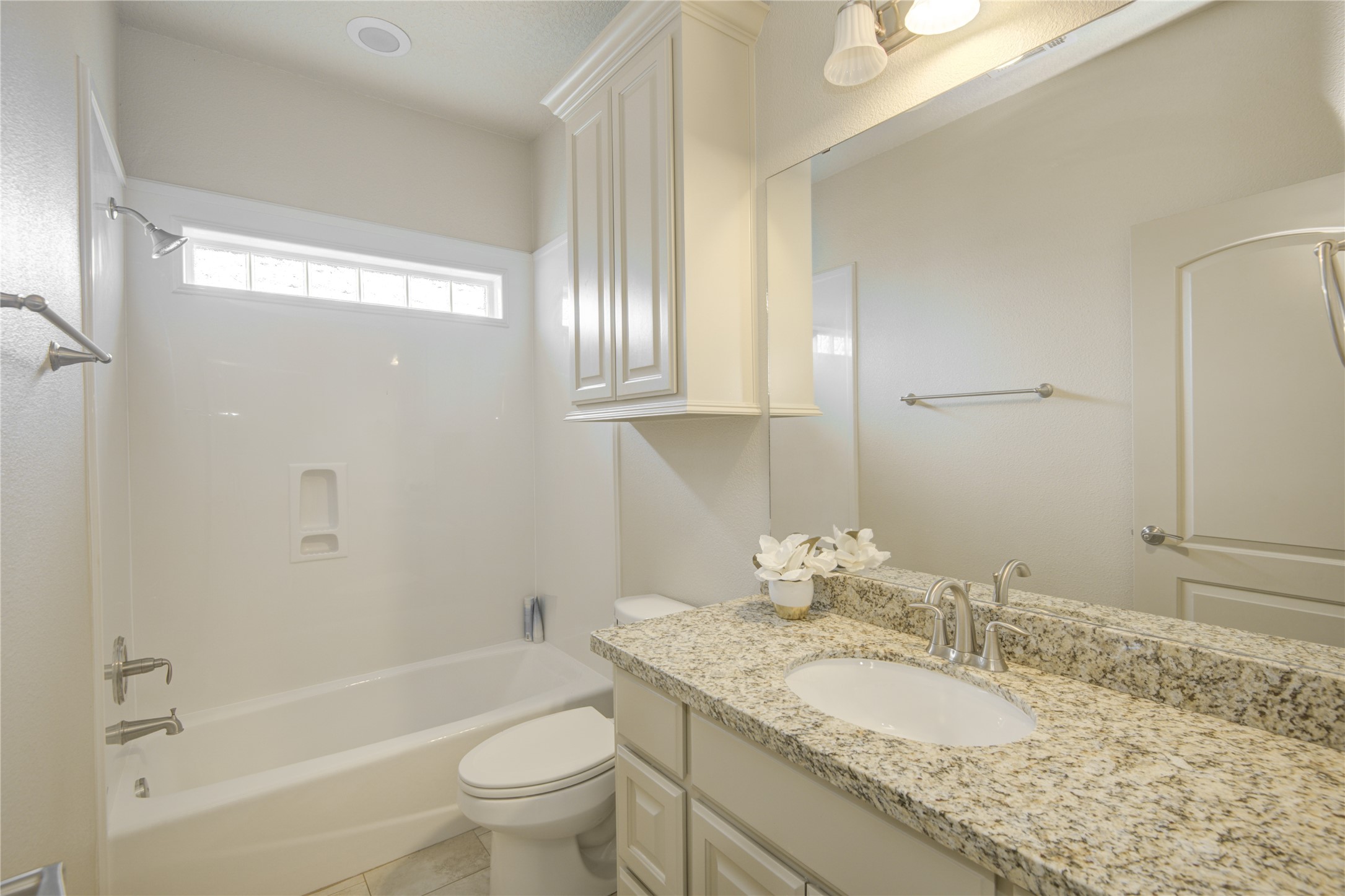 57 Red Maple Court Lake Jackson, TX 77566 - Photo 38 of 44 a bathroom with a granite countertop tub sink and mirror