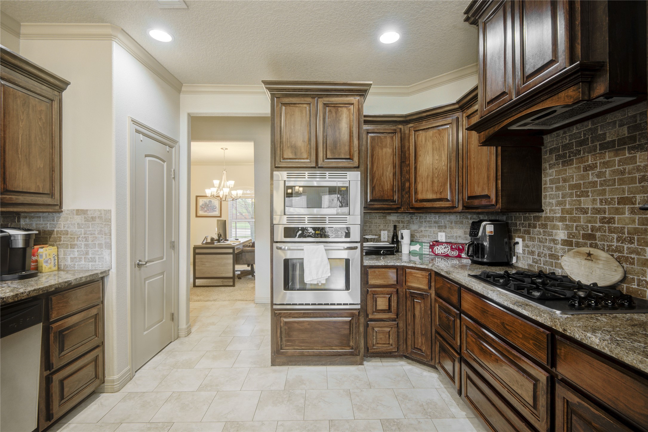 57 Red Maple Court Lake Jackson, TX 77566 - Photo 8 of 44 a kitchen with granite countertop stainless steel appliances and cabinets